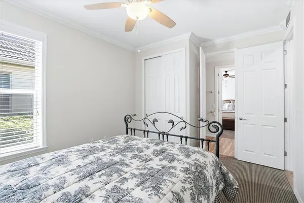 a bedroom with a bed a table and chair