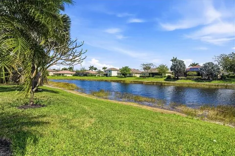 a view of a lake with houses in the back