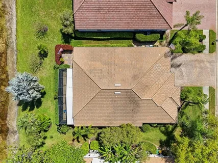 an aerial view of a house having yard