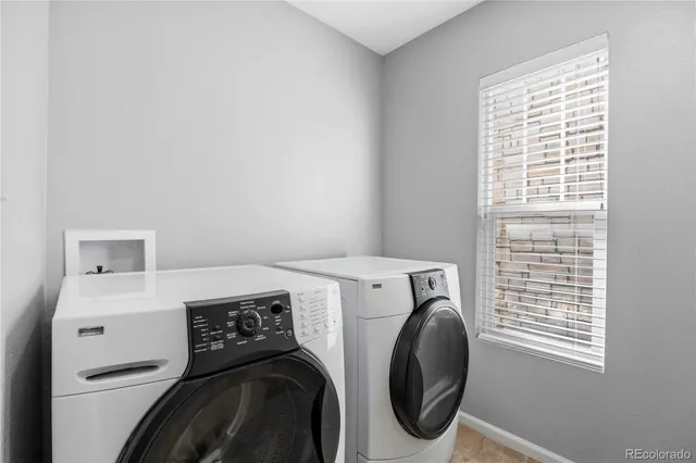 a view of a brick house with a large window
