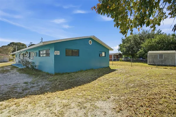 a house view with a backyard space
