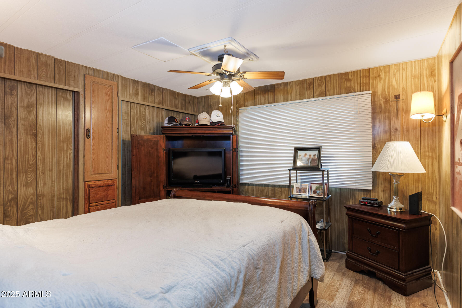 2100 North Trekell Road, Unit 333 Casa Grande, AZ 85122 - Photo 15 of 39 a bedroom with a bed and a chandelier