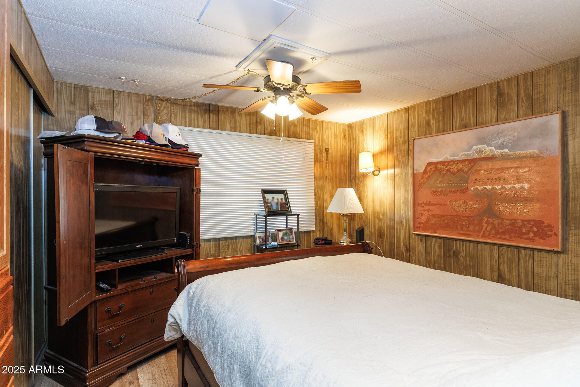 2100 North Trekell Road, Unit 333 Casa Grande, AZ 85122 - Photo 16 of 39 a bedroom with a bed and a flat screen tv