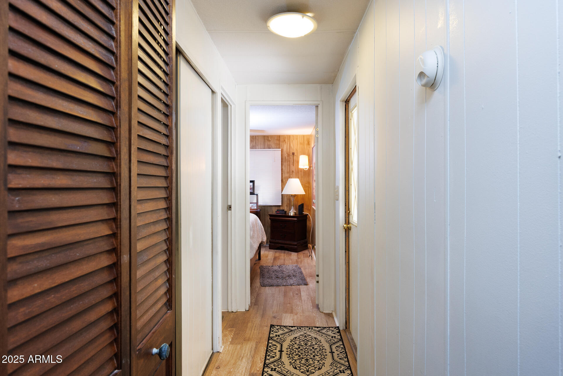 2100 North Trekell Road, Unit 333 Casa Grande, AZ 85122 - Photo 17 of 39 a view of a hallway with a livingroom and a bathroom with sink