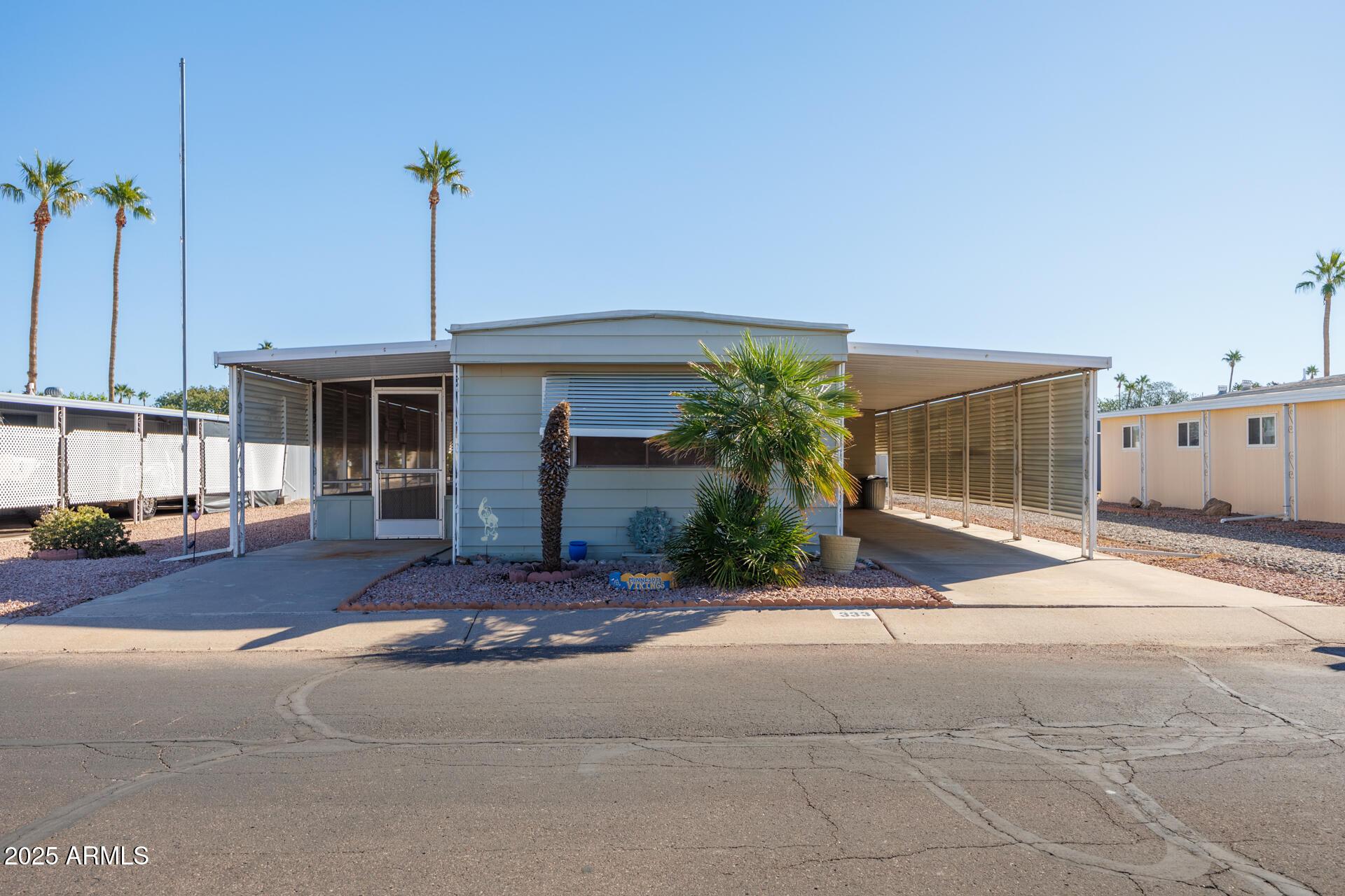 2100 North Trekell Road, Unit 333 Casa Grande, AZ 85122 - Photo 2 of 39 a front view of a house with a garden and plants