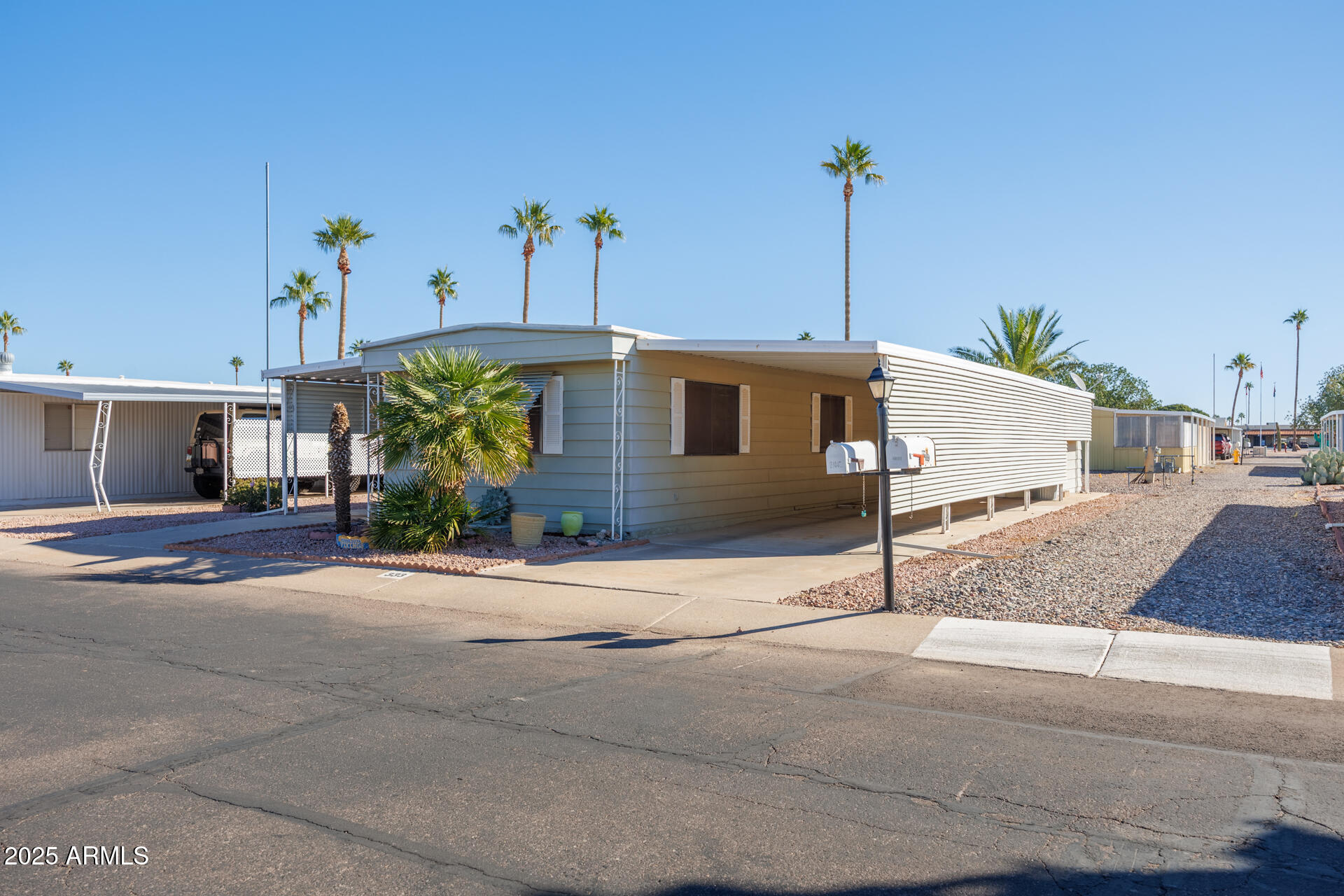 2100 North Trekell Road, Unit 333 Casa Grande, AZ 85122 - Photo 3 of 39 a front view of a house with a yard and garage