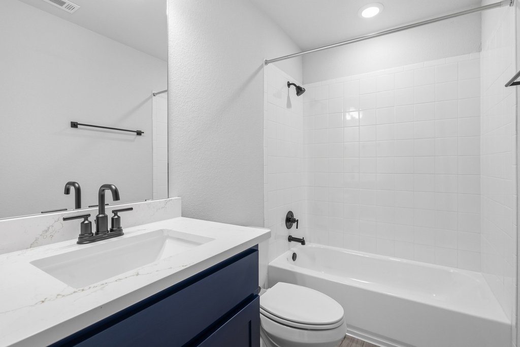 8001 Andravida Drive Austin, TX 78747 - Photo 26 of 35 Secondary bath with modern finishes; home features 3 full bathrooms