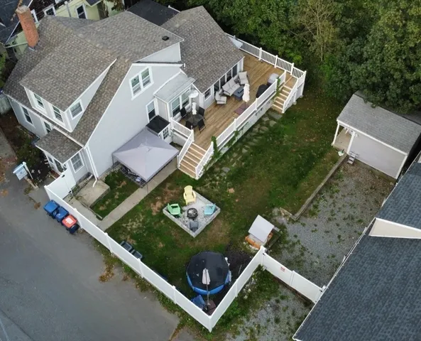 an aerial view of house with yard