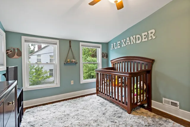 a bedroom with furniture and a window