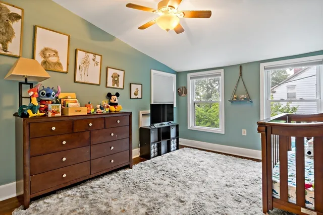 a bed room with a bed and a window