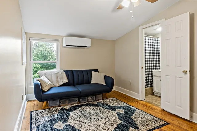 a living room with furniture and a rug