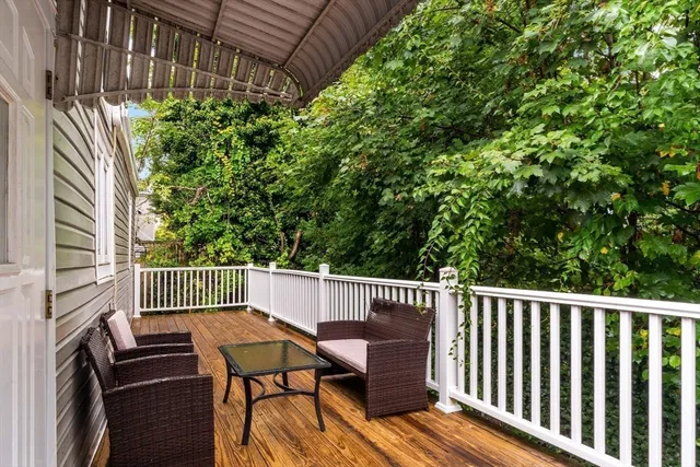 a view of a two chairs and table in the balcony