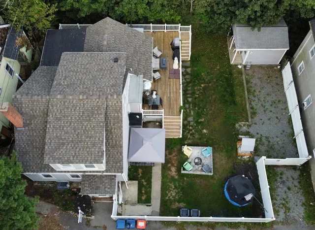 a picture of a bench in front of a wall