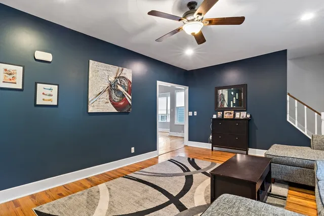a work room with furniture and a chandelier