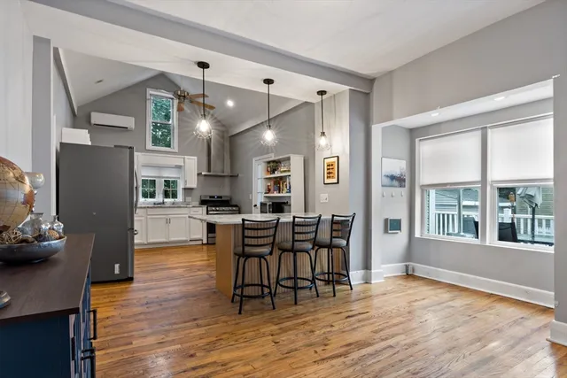 a view of a dining room with furniture window and wooden floor