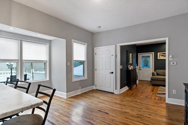 a view of a livingroom with furniture and hardwood floor
