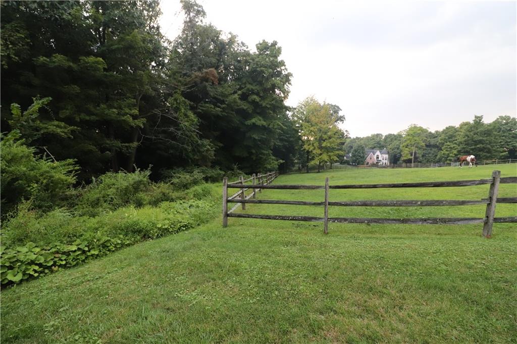 415 Redgate Road Sewickley, PA 15143 - Photo 9 of 25 Once upon a time there was a full lane to the left of this fence line, which bordered LOT 52.