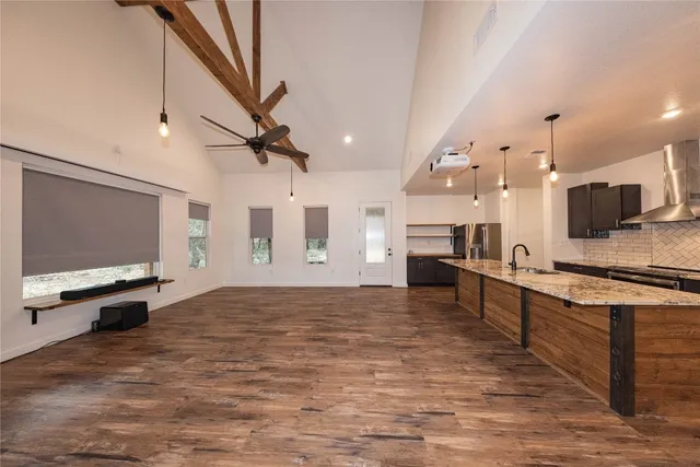 a view of kitchen and sink with microwave