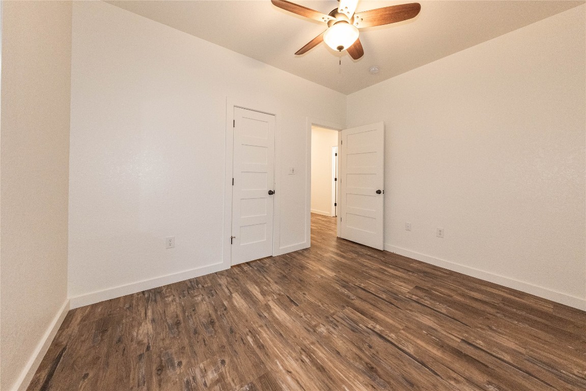 201 Frontier Trail Wimberley, TX 78676 - Photo 27 of 37 wooden floor in an empty room