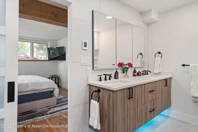 a bathroom with a sink and a mirror