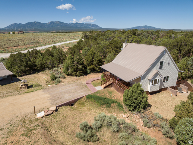 684 Blue Mountain Ridge Monticello, UT 84535 - Photo 7 of 71 Aerial view of property and surrounding area featuring mountains