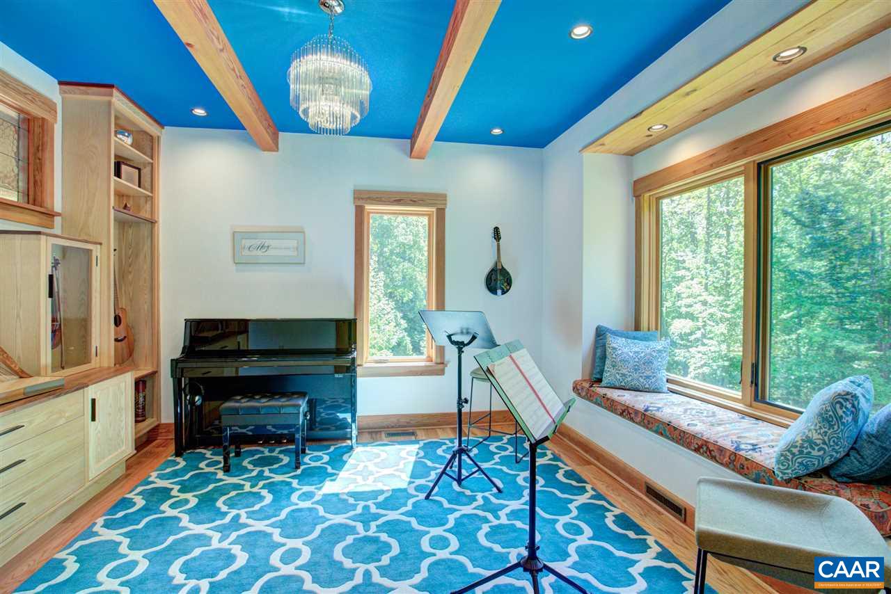 100 Miller School Road Charlottesville, VA 22903 - Photo 12 of 47 a living room with furniture and a floor to ceiling window