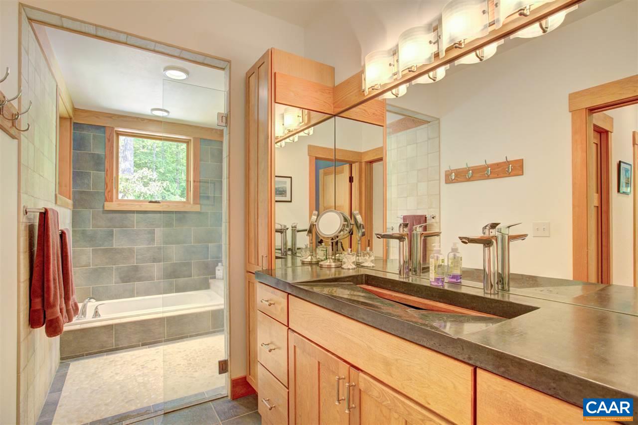 100 Miller School Road Charlottesville, VA 22903 - Photo 22 of 47 a bathroom with a granite countertop sink and a mirror