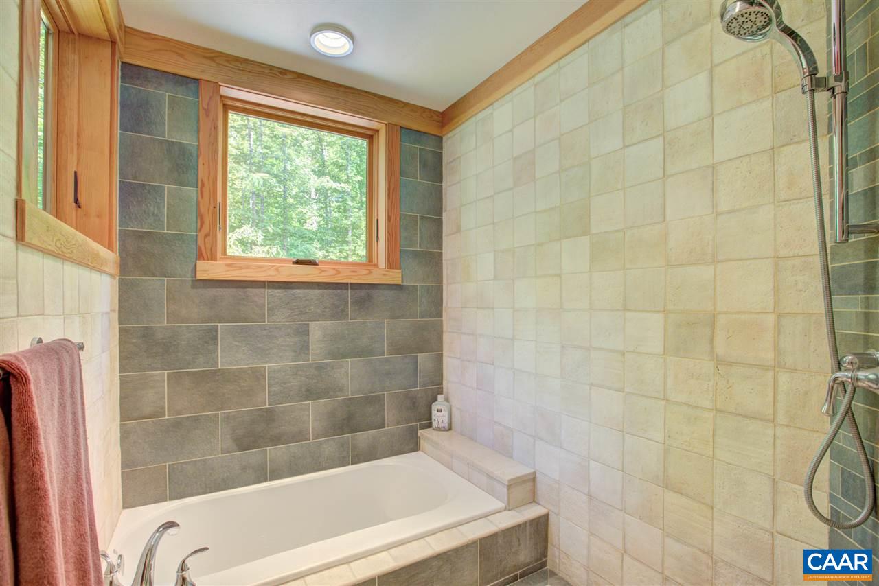 100 Miller School Road Charlottesville, VA 22903 - Photo 23 of 47 a bathroom with a bathtub and shower