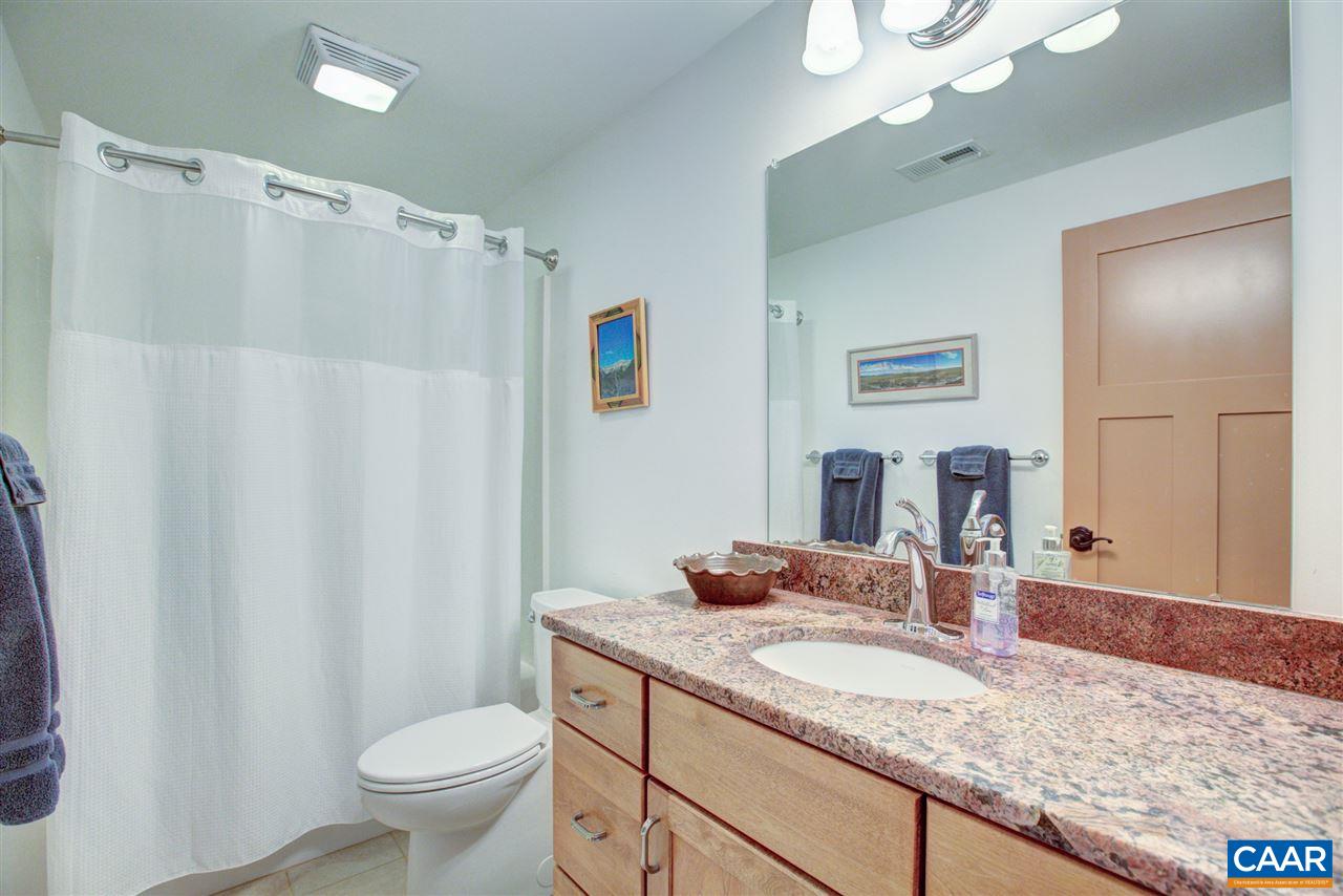 100 Miller School Road Charlottesville, VA 22903 - Photo 31 of 47 a bathroom with a granite countertop sink a toilet and a mirror