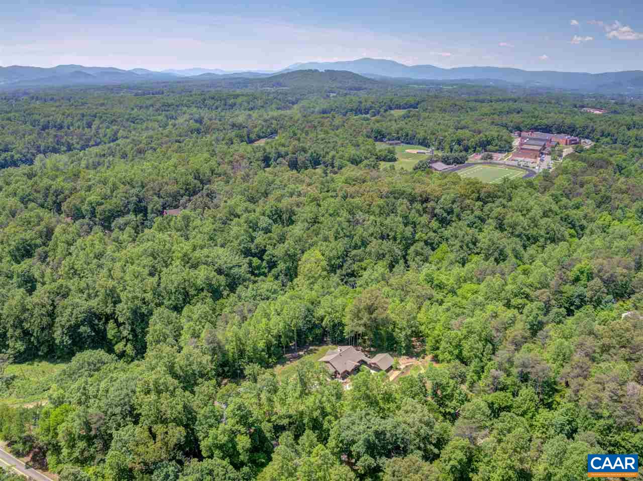 100 Miller School Road Charlottesville, VA 22903 - Photo 38 of 47 a view of a lush green hillside and a houses