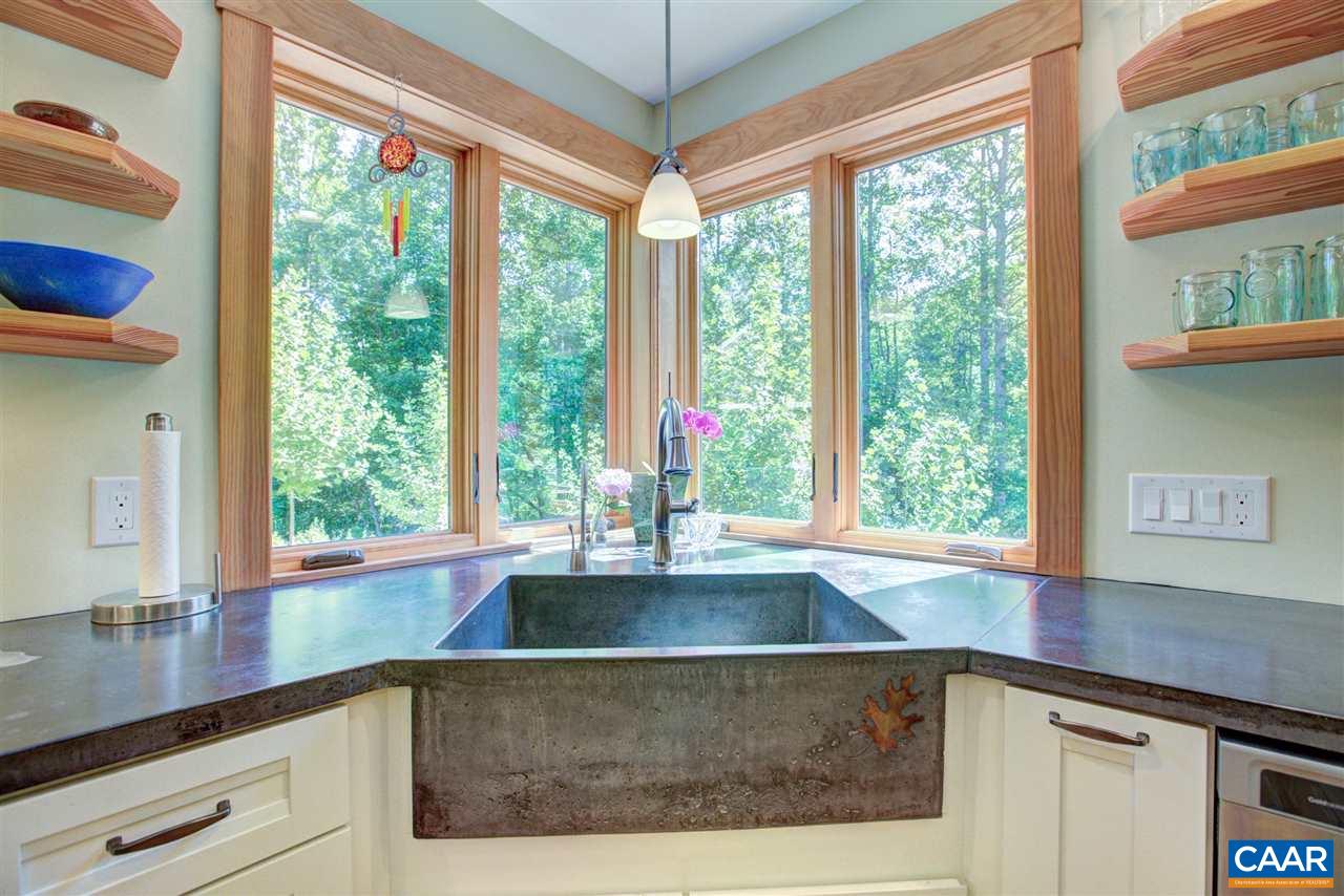 100 Miller School Road Charlottesville, VA 22903 - Photo 45 of 47 a view of a kitchen with kitchen island a large window in it