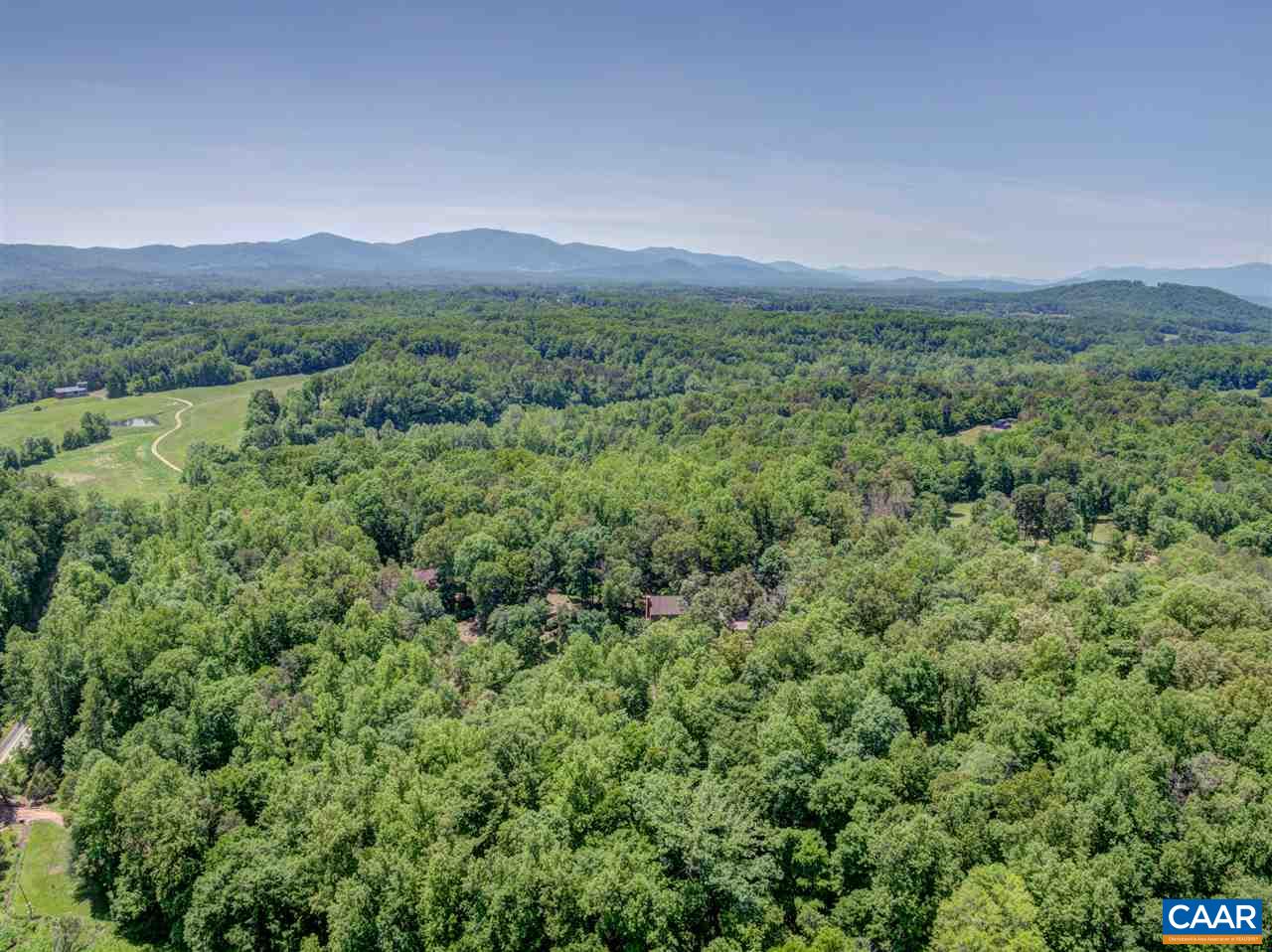 100 Miller School Road Charlottesville, VA 22903 - Photo 6 of 47 a view of a lush green hillside and a houses