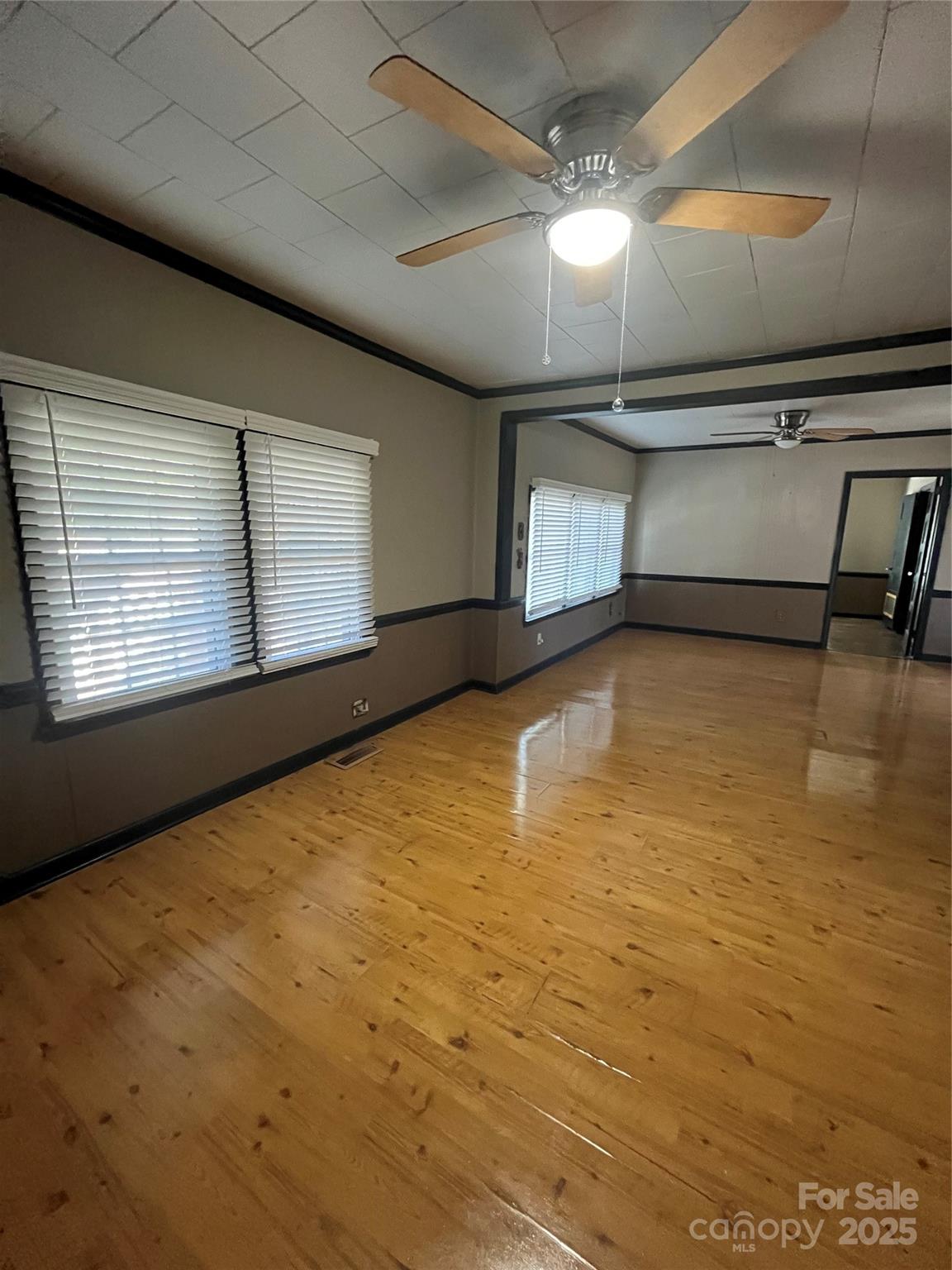 9404 Providence Road South Waxhaw, NC 28173 - Photo 28 of 45 a view of an empty room with window and chandelier fan