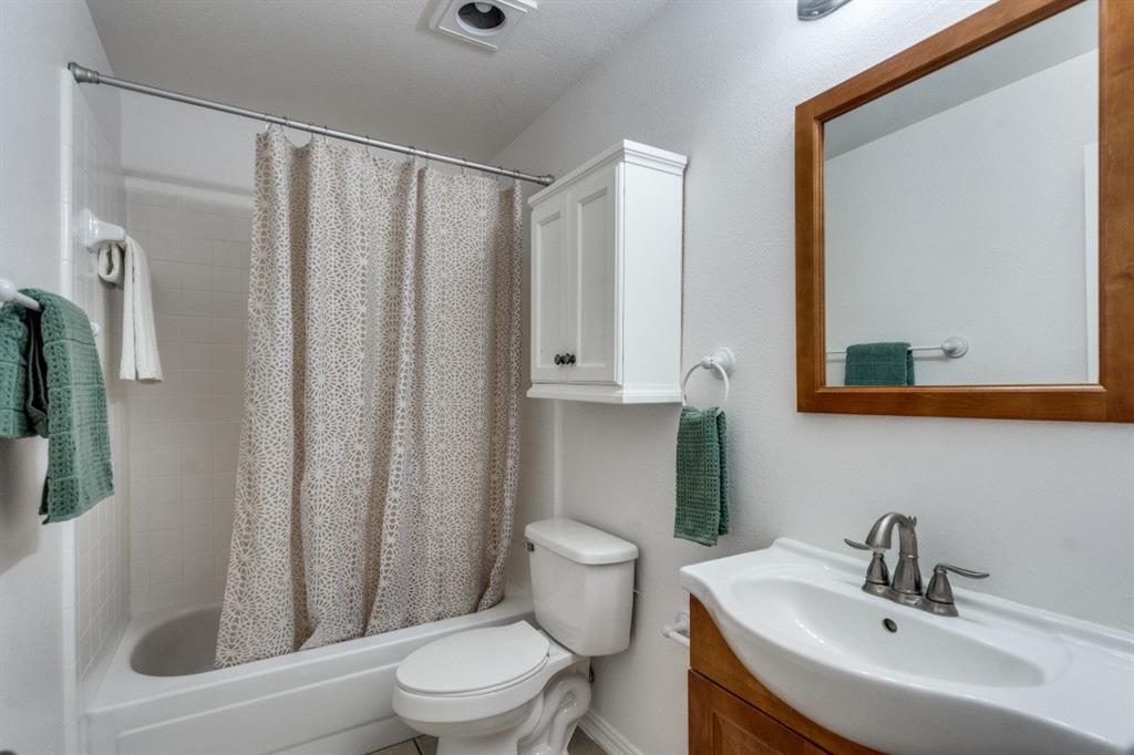 1509 Clover Drive Allen, TX 75002 - Photo 10 of 25 a bathroom with a sink toilet and shower