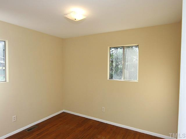 2308 Sheffield Road Raleigh, NC 27610 - Photo 8 of 11 2nd bedroom with hardwoods and fresh paint. Bedroom
