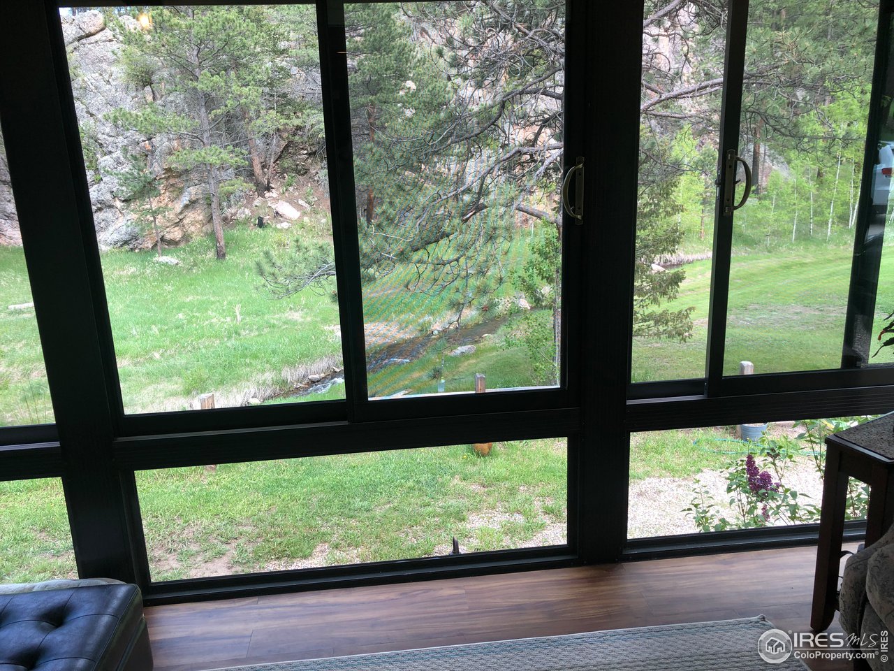 5860 Stove Prairie Road Bellvue, CO 80512 - Photo 14 of 40 Tranquil View & Sounds of the Creek, from Sunroom
