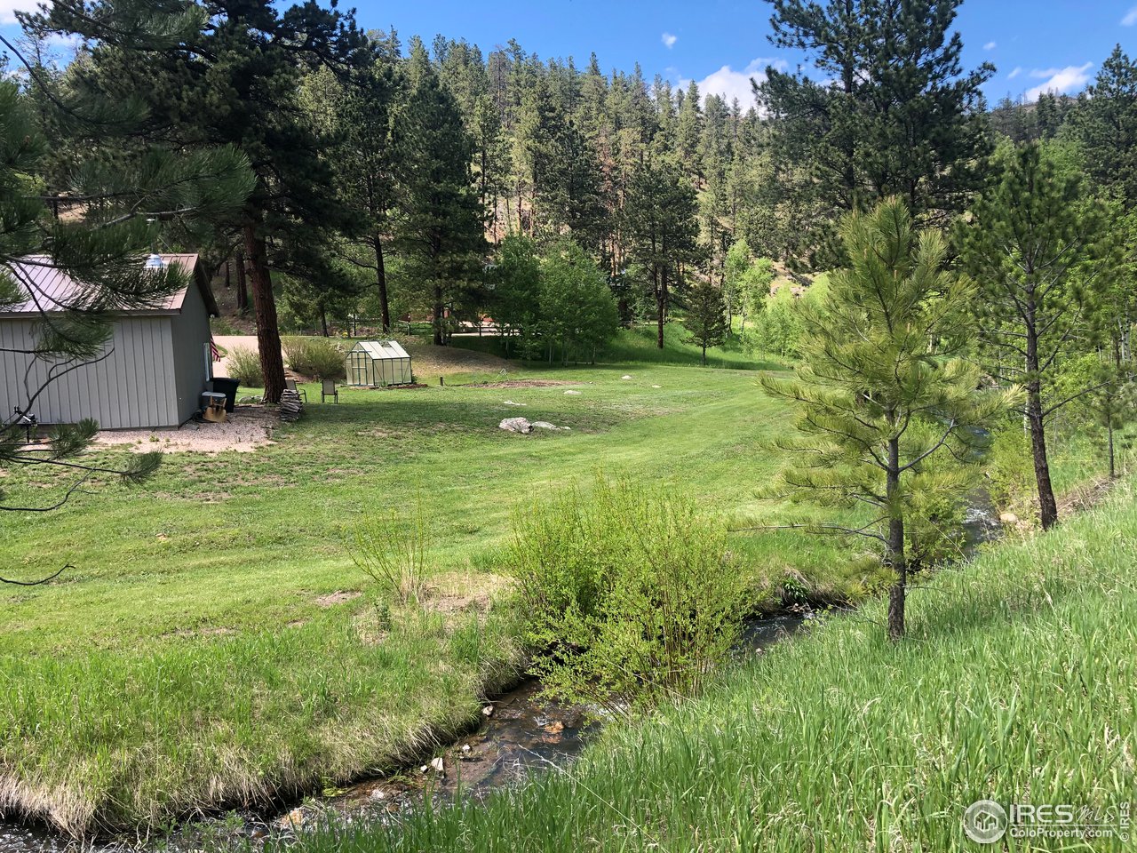 5860 Stove Prairie Road Bellvue, CO 80512 - Photo 34 of 40 View from the Creek's Entrance to the Property
