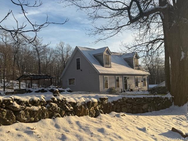 50 Continental Road Warwick, NY 10990 - Photo 18 of 36 a front view of a house with a yard covered with snow