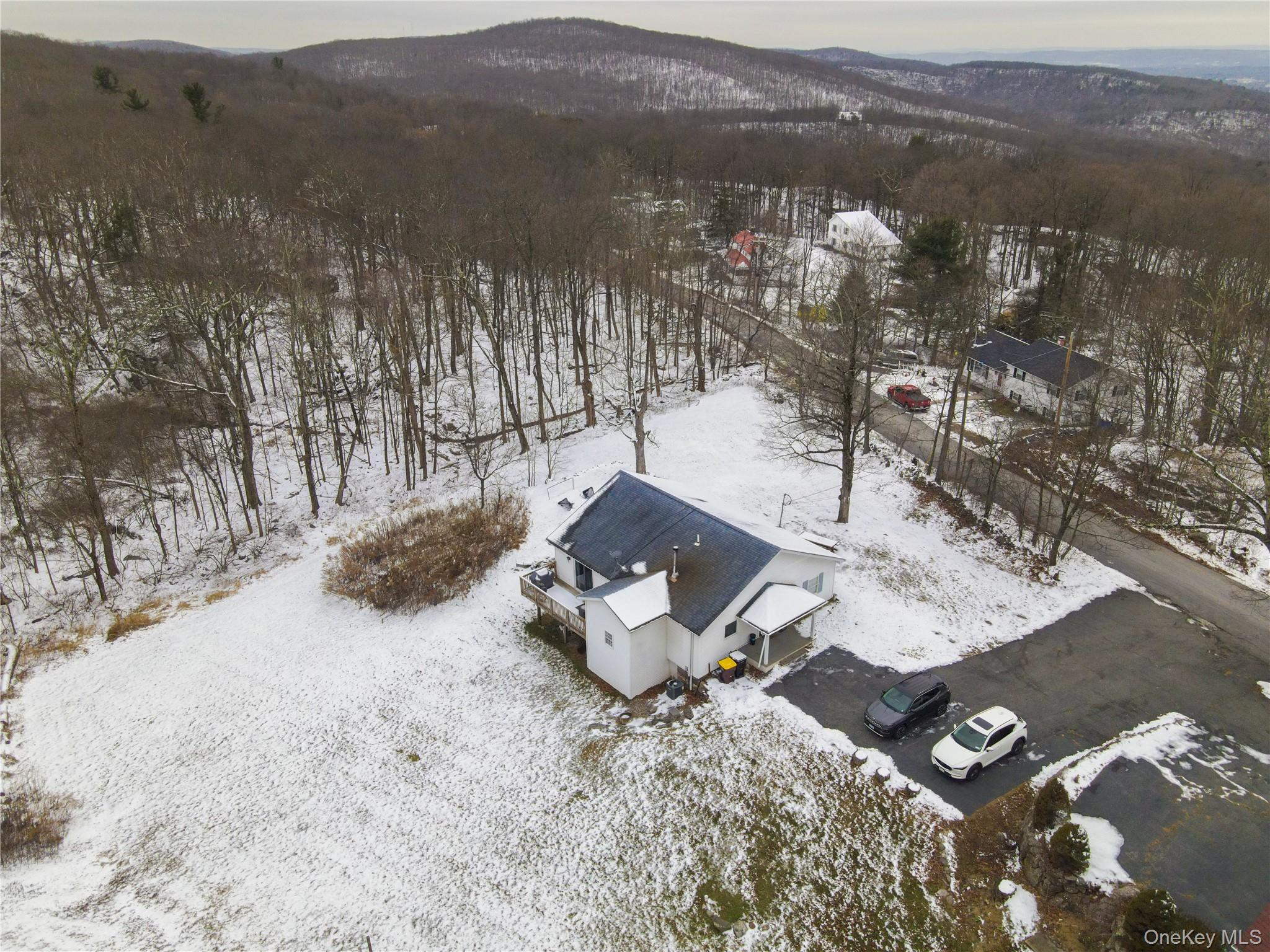 50 Continental Road Warwick, NY 10990 - Photo 22 of 36 a view of a wooden house with a yard