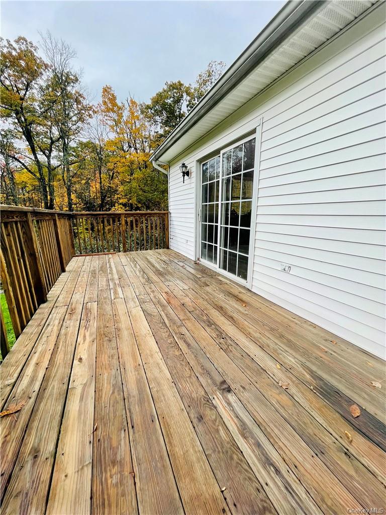 50 Continental Road Warwick, NY 10990 - Photo 8 of 36 a view of balcony with wooden floor and fence