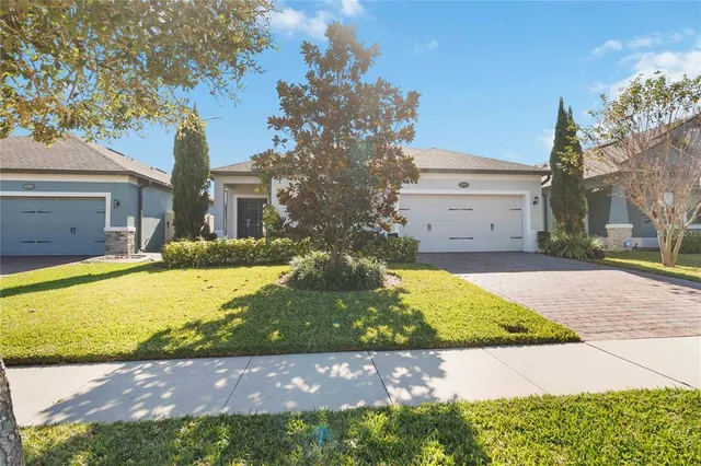 a view of a house with a yard