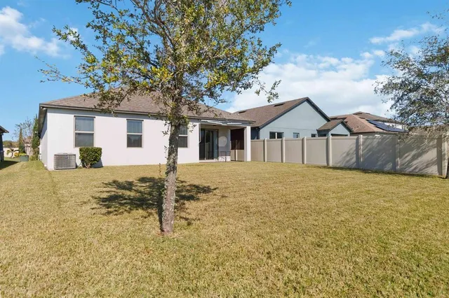 a house with trees in the background