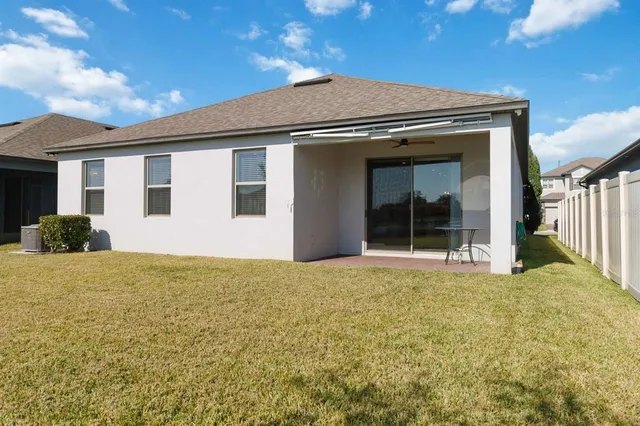 a house view with swimming pool and porch