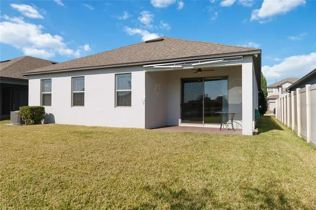 a house view with swimming pool and porch