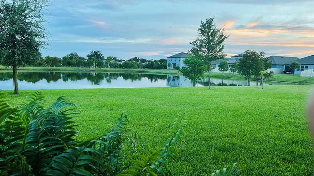a view of a golf course with a lake