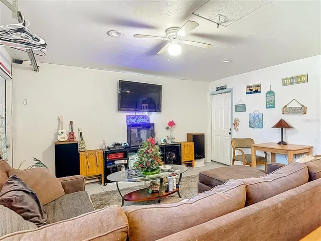 a backyard of a house with potted plants
