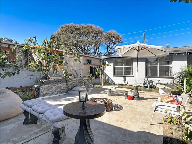 a swimming pool with outdoor seating