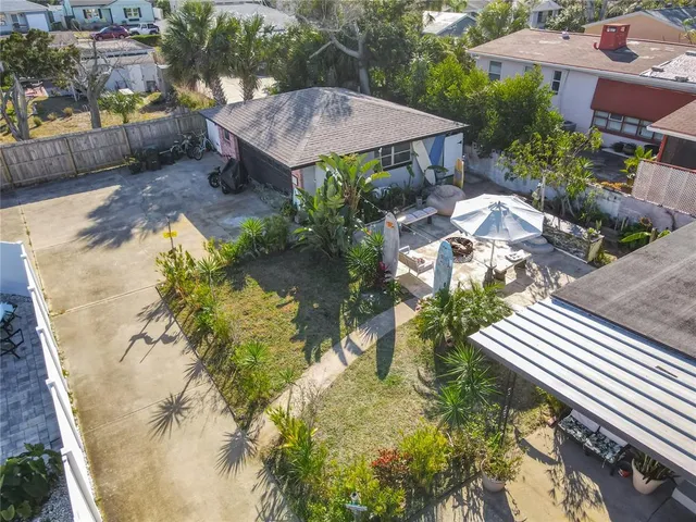 an aerial view of a house with a garden