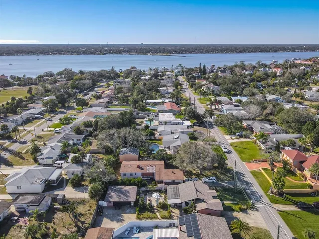 an aerial view of a city with ocean view