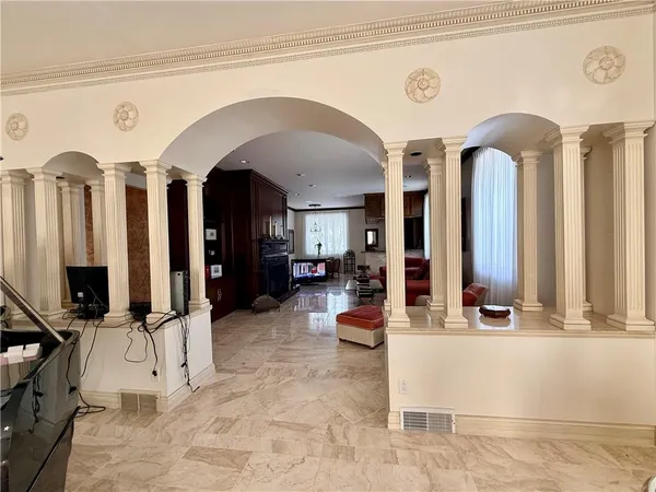 a living room with furniture or couch and a bookshelf